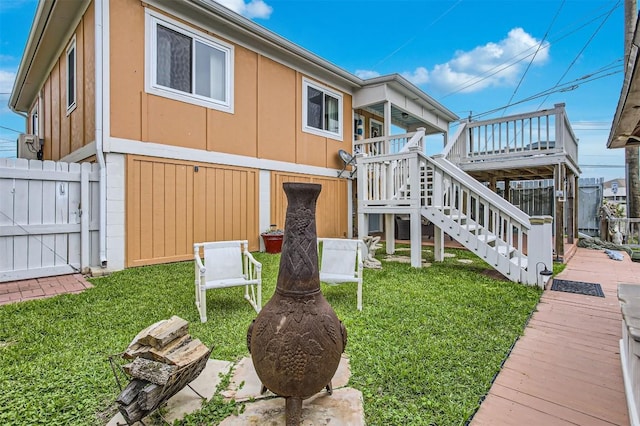 view of home's exterior with stairway and a wooden deck