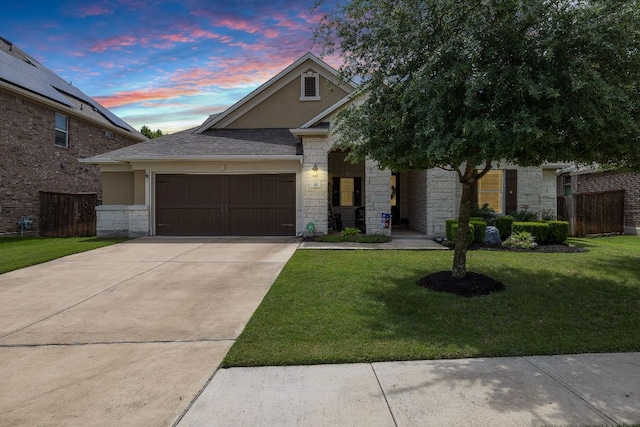 417 Freeman Park Pl, Round Rock, TX 78665 - view of front of property featuring stone siding, a garage, driveway, and stucco siding