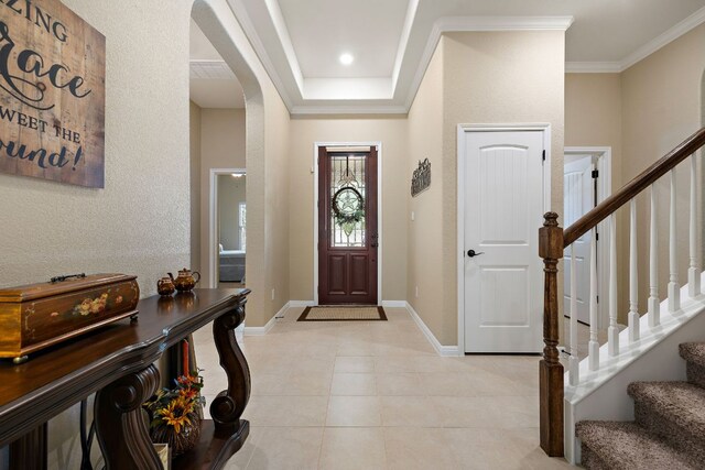 417 Freeman Park Pl, Round Rock, TX 78665 - entryway featuring arched walkways, stairs, ornamental molding, and baseboards