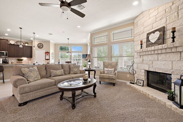 417 Freeman Park Pl, Round Rock, TX 78665 - living area featuring ceiling fan, crown molding, light carpet, recessed lighting, and a fireplace