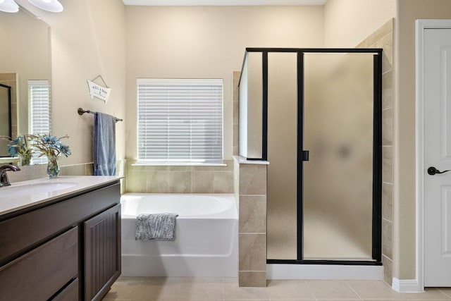 417 Freeman Park Pl, Round Rock, TX 78665 - full bathroom with a shower stall, vanity, a garden tub, and tile patterned floors