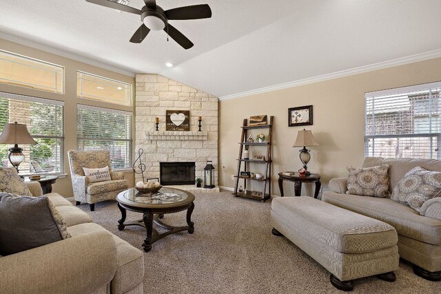 417 Freeman Park Pl, Round Rock, TX 78665 - living area with a ceiling fan, ornamental molding, carpet, vaulted ceiling, and a stone fireplace