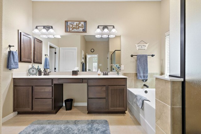 417 Freeman Park Pl, Round Rock, TX 78665 - full bathroom featuring double vanity, tile patterned flooring, a bath, and a stall shower