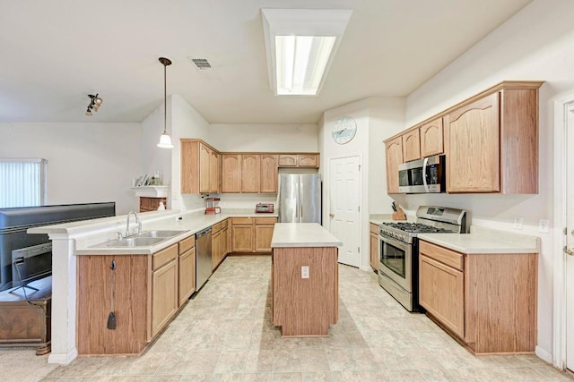kitchen featuring stainless steel appliances, a sink, a center island, a peninsula, and light countertops