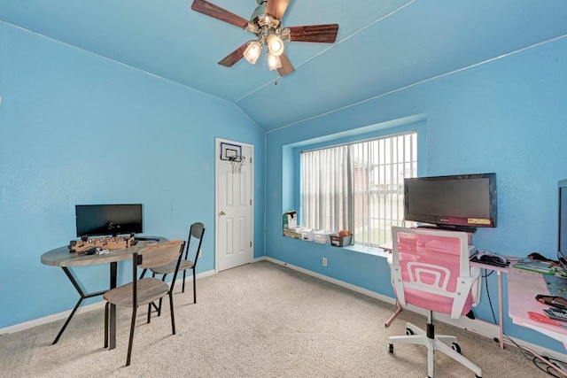 carpeted office space with a ceiling fan, lofted ceiling, and baseboards