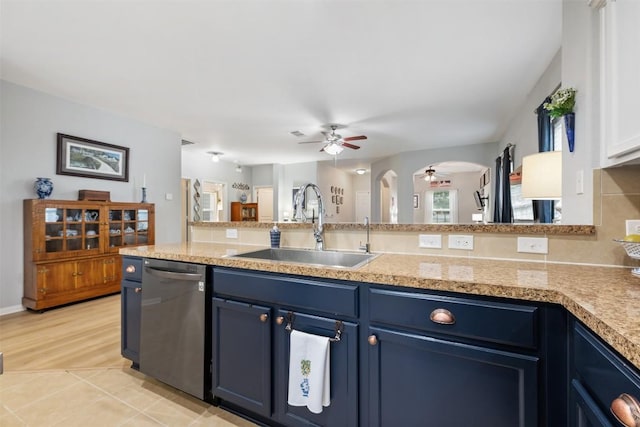 360 Waterloo Dr, Kyle, TX 78640 - kitchen featuring dishwasher, ceiling fan, blue cabinetry, a sink, and light countertops