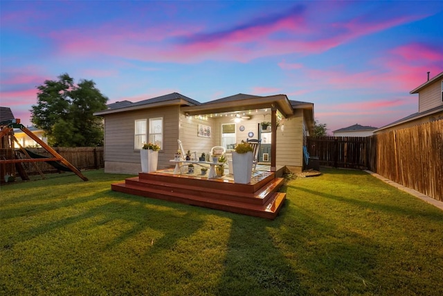 back of property featuring a deck
