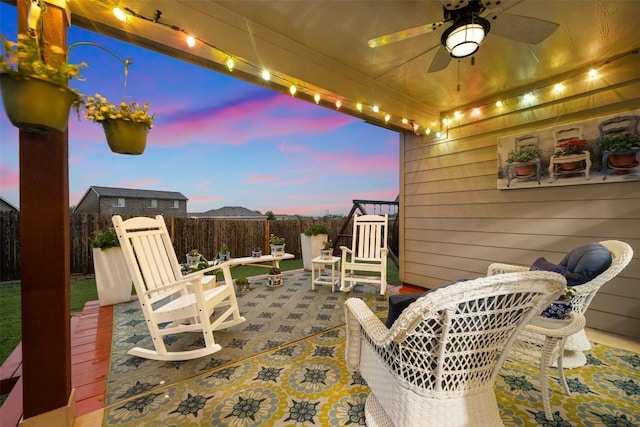 view of patio with a fenced backyard and a ceiling fan