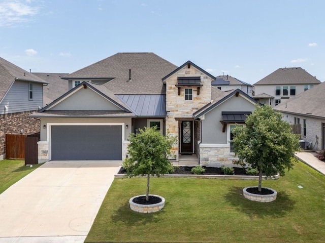 20513 Christie Marie Ln, Pflugerville, TX 78660 - view of front of house featuring stone siding, a standing seam roof, an attached garage, driveway, and stucco siding
