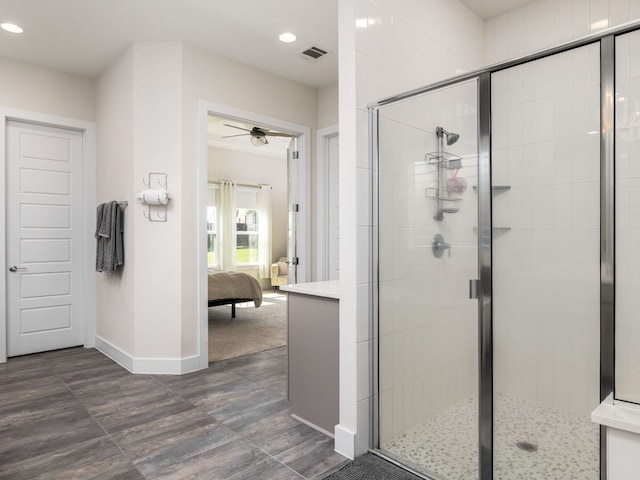 20513 Christie Marie Ln, Pflugerville, TX 78660 - ensuite bathroom featuring a shower stall, baseboards, a ceiling fan, and recessed lighting