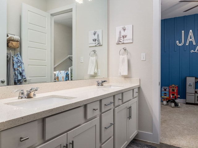 20513 Christie Marie Ln, Pflugerville, TX 78660 - bathroom featuring double vanity and baseboards