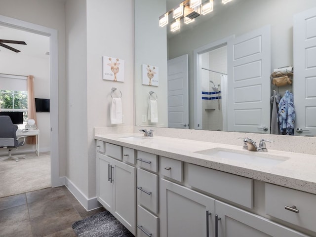 20513 Christie Marie Ln, Pflugerville, TX 78660 - bathroom with baseboards, double vanity, curtained shower, and ceiling fan