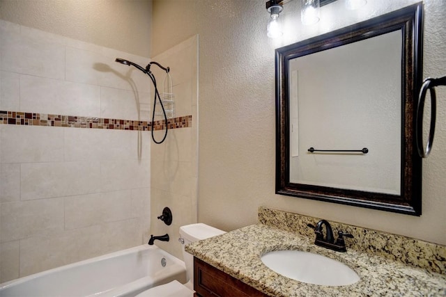 full bathroom with a textured wall, vanity,  shower combination, and toilet