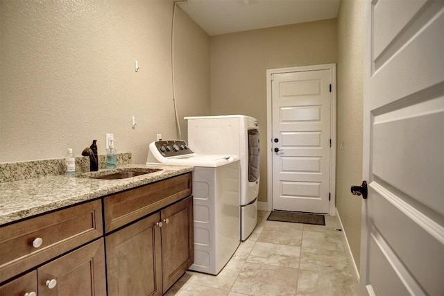 laundry area featuring washer and dryer and cabinet space