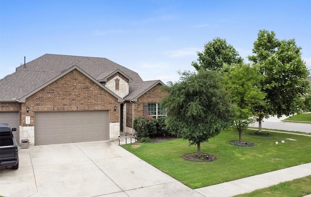 view of front of property featuring an attached garage, brick siding, concrete driveway, a front yard, and a shingled roof