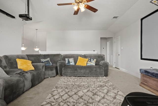 cinema room featuring carpet floors, ceiling fan, vaulted ceiling, and baseboards