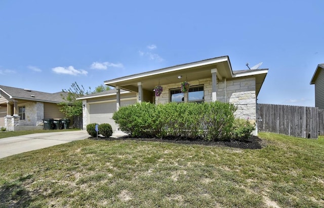 ranch-style house with stone siding, an attached garage, and concrete driveway