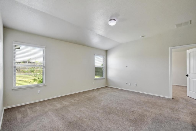 empty room with carpet and baseboards