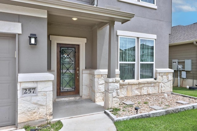 257 Falling Star Ln, Georgetown, TX 78628 - property entrance with stone siding and stucco siding