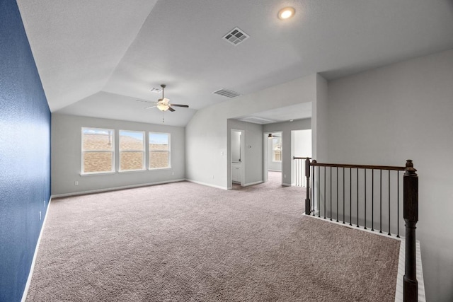 257 Falling Star Ln, Georgetown, TX 78628 - carpeted spare room with a ceiling fan, baseboards, and vaulted ceiling