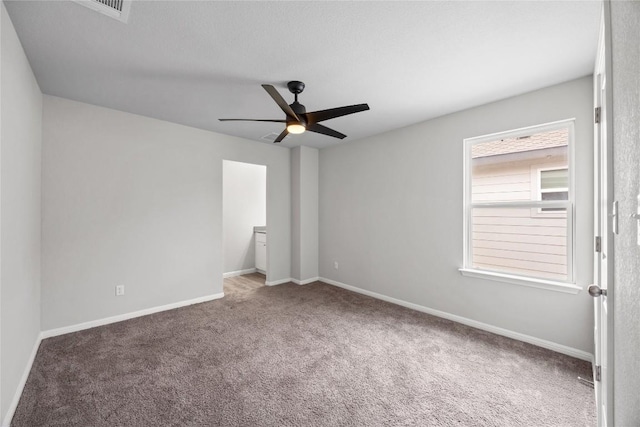 257 Falling Star Ln, Georgetown, TX 78628 - carpeted spare room featuring a ceiling fan and baseboards