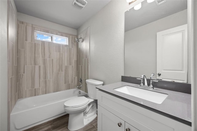 257 Falling Star Ln, Georgetown, TX 78628 - bathroom featuring toilet, bathtub / shower combination, vanity, and wood finished floors