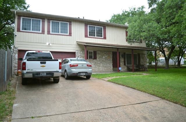 907 Pepperell Ct, Austin, TX 78753 - view of front facade with stone siding, driveway, a garage, and a front lawn
