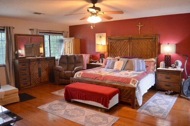 907 Pepperell Ct, Austin, TX 78753 - bedroom with wood finished floors and ceiling fan