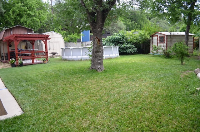 907 Pepperell Ct, Austin, TX 78753 - view of yard with a shed, an outbuilding, an outdoor pool, and a gazebo
