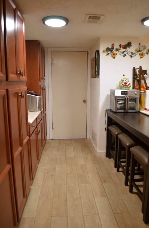 907 Pepperell Ct, Austin, TX 78753 - hallway featuring light wood-style flooring