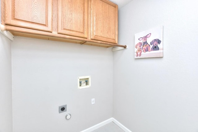 laundry area featuring cabinet space, hookup for an electric dryer, hookup for a washing machine, and baseboards