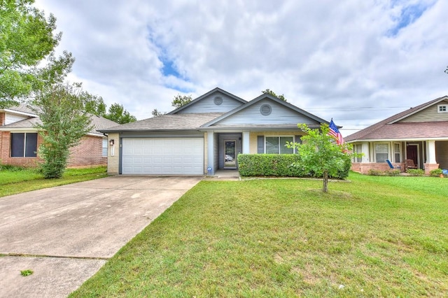 single story home featuring a garage, concrete driveway, a front yard, and brick siding
