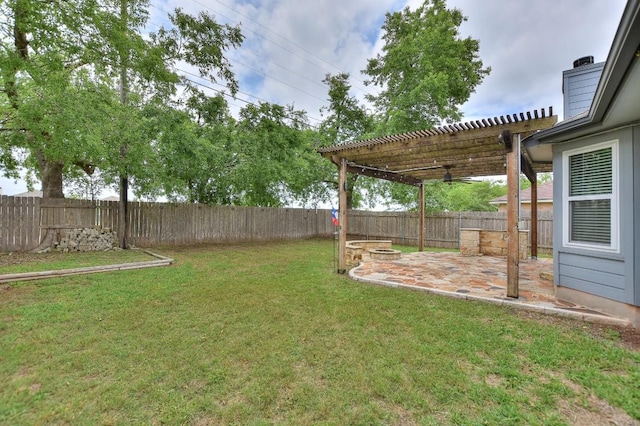 view of yard featuring a patio, a pergola, and a fire pit