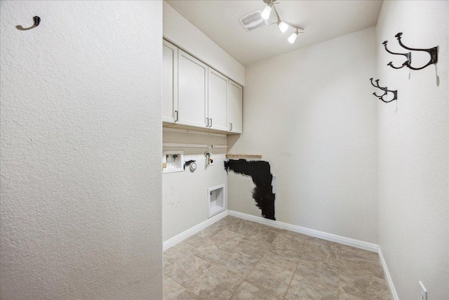 laundry area with cabinet space, gas dryer hookup, hookup for a washing machine, baseboards, and hookup for an electric dryer