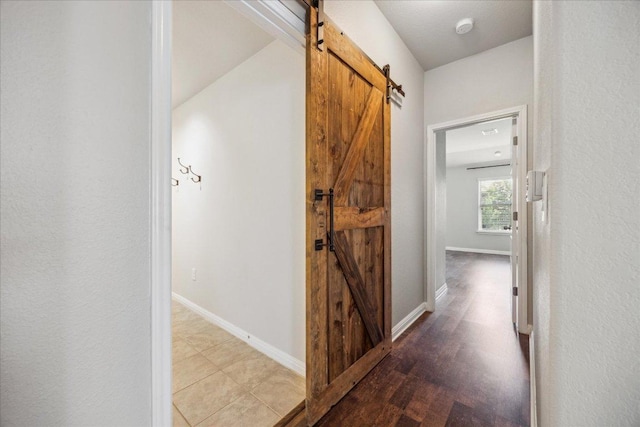 504 Longhorn Cavern Rd, Leander, TX 78641 - corridor featuring a barn door and baseboards