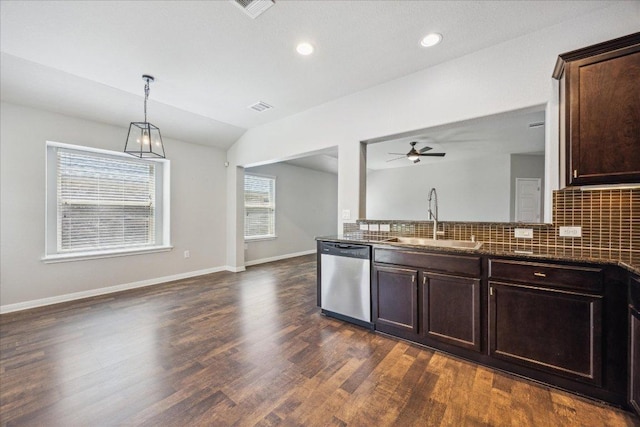504 Longhorn Cavern Rd, Leander, TX 78641 - kitchen with stainless steel dishwasher, ceiling fan, dark wood-style floors, decorative backsplash, and open floor plan