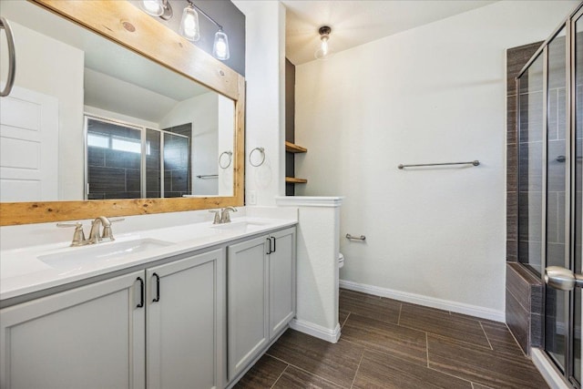 504 Longhorn Cavern Rd, Leander, TX 78641 - full bathroom with double vanity and a stall shower