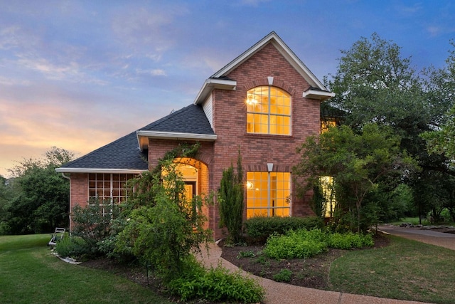 5316 China Garden Dr, Austin, TX 78730 - traditional home with brick siding, roof with shingles, and a front lawn
