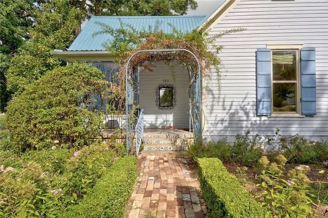 101 Short St, Smithville, TX 78957 - view of exterior entry with a metal roof and covered porch