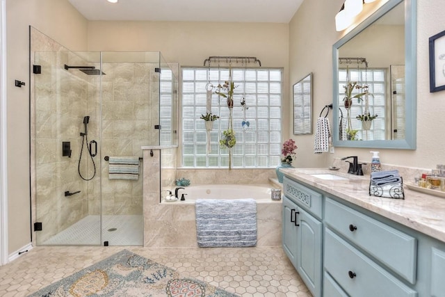 109 Cattle Trail Way, Georgetown, TX 78633 - full bathroom with a garden tub, a stall shower, vanity, and tile patterned flooring