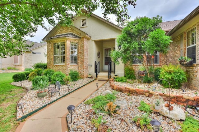 109 Cattle Trail Way, Georgetown, TX 78633 - view of front of house with brick siding and stucco siding
