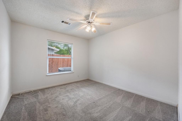 8309 Burrell Dr, Austin, TX 78757 - unfurnished room featuring carpet floors, a ceiling fan, a textured ceiling, and baseboards