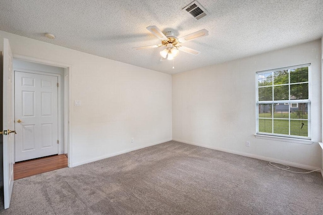8309 Burrell Dr, Austin, TX 78757 - carpeted empty room featuring ceiling fan, a textured ceiling, baseboards, and a smoke detector
