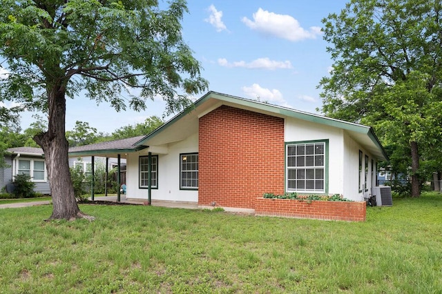 8309 Burrell Dr, Austin, TX 78757 - view of property exterior featuring central AC and a lawn