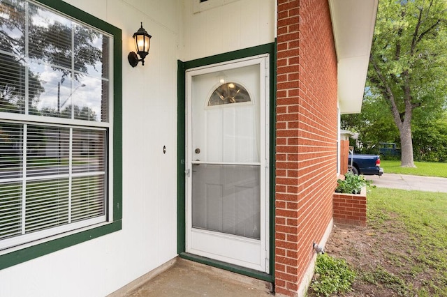 8309 Burrell Dr, Austin, TX 78757 - doorway to property featuring brick siding