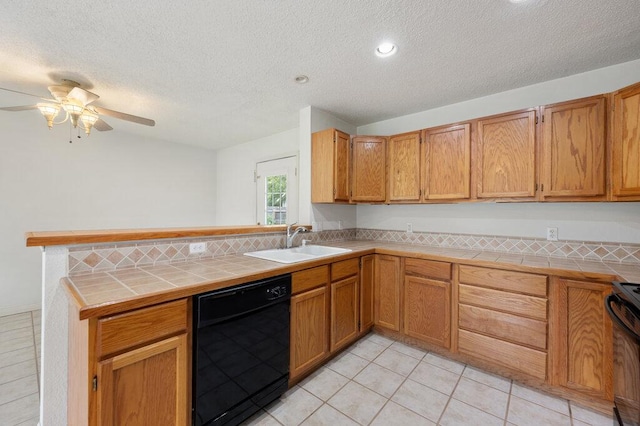 8309 Burrell Dr, Austin, TX 78757 - kitchen with black dishwasher, a sink, tile counters, a peninsula, and range