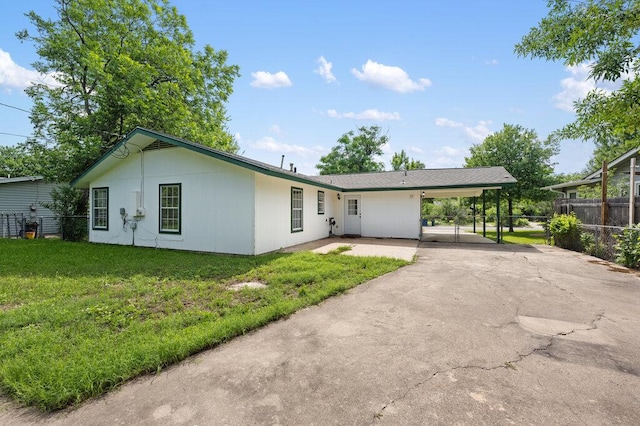 8309 Burrell Dr, Austin, TX 78757 - view of front of house featuring asphalt driveway and a carport