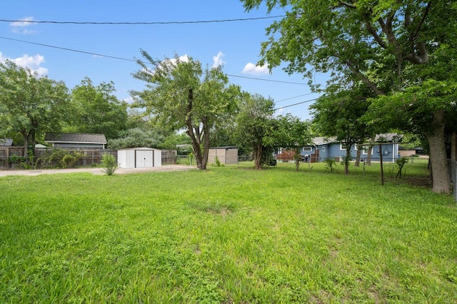 8309 Burrell Dr, Austin, TX 78757 - view of yard featuring a storage unit and an outdoor structure
