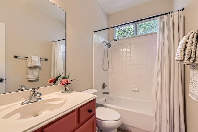 bathroom featuring shower / bath combo, vanity, and toilet