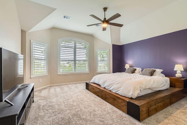 bedroom with carpet floors, vaulted ceiling, baseboards, and a ceiling fan
